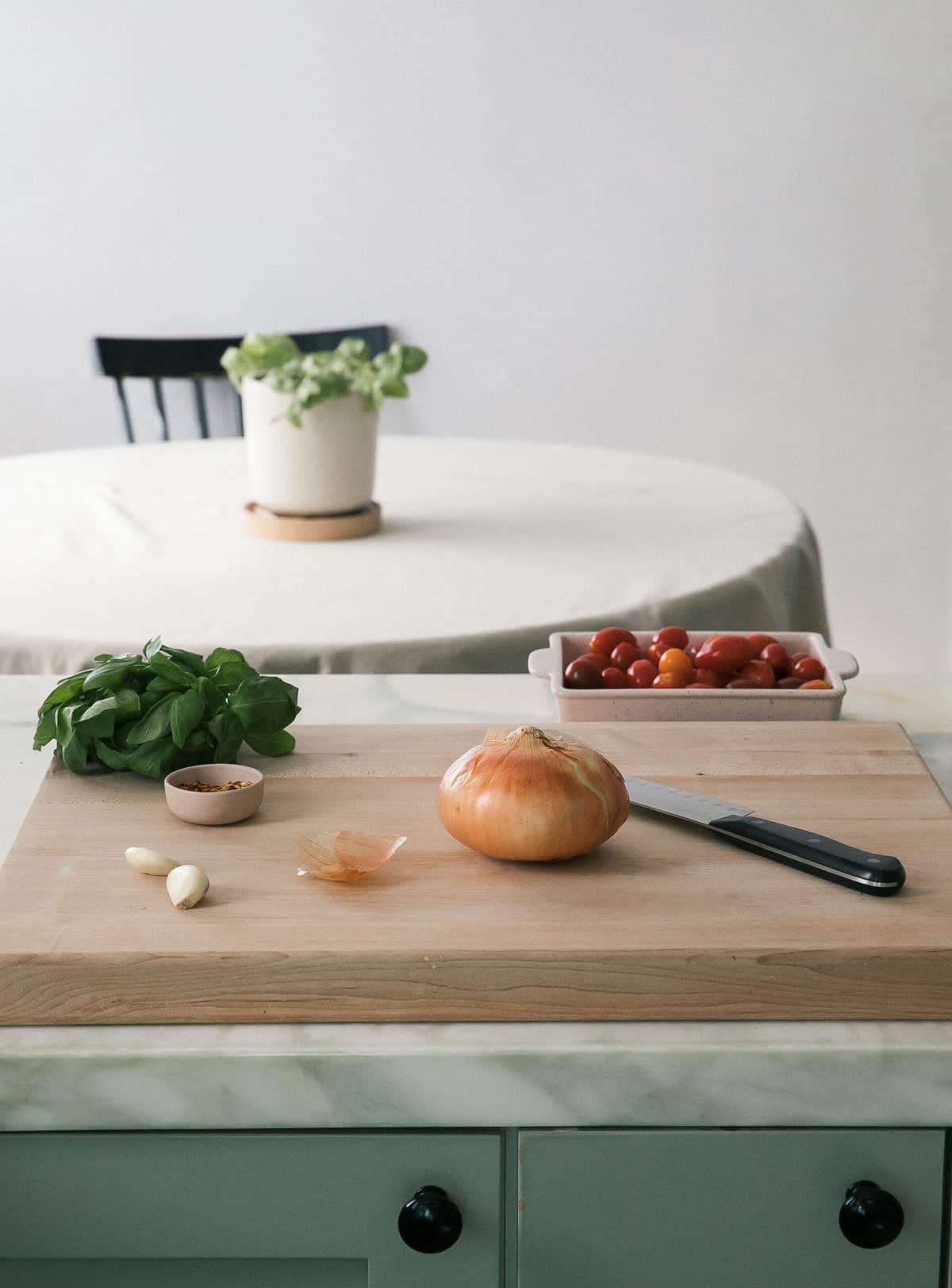 Prepping ingredients on cutting board. 