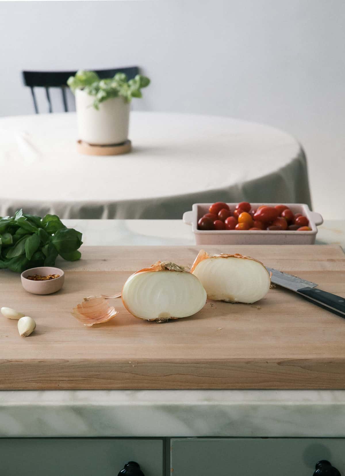 Prepping ingredients on cutting board. 