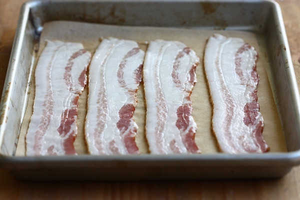 Bacon on a baking sheet pre-baking. 