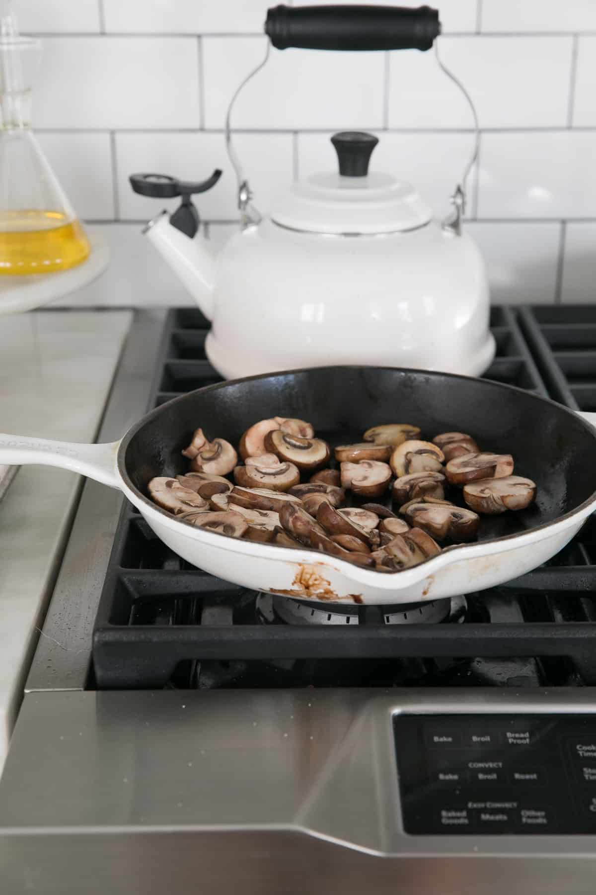 Sautéed mushrooms in pan. 