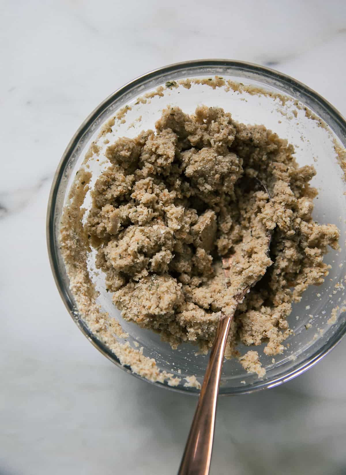 Breadcrumbs mixed with milk in a small bowl. 