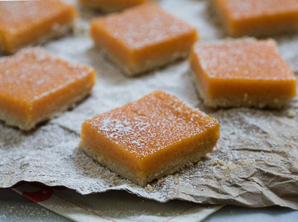 Papaya Bars on parchment paper.