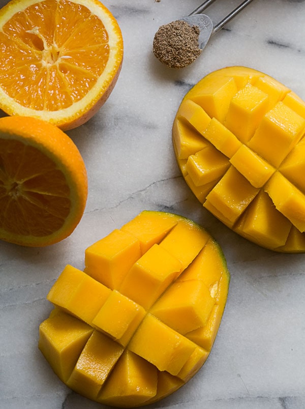 Mango Cardamom and Sweet Coconut Popsicles  www.acozykitchen.com