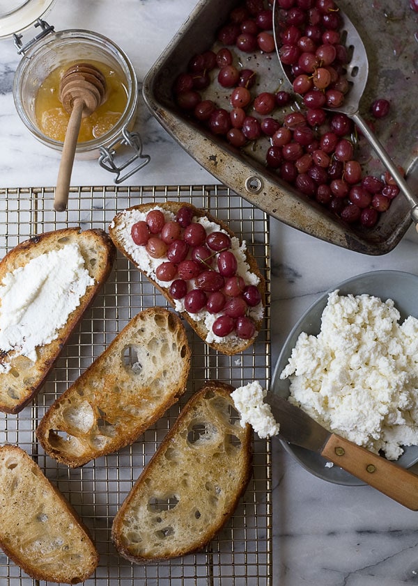 Roasted Grape Ricotta Crostinis with Rosemary and Pinenuts // www.acozykitchen.com