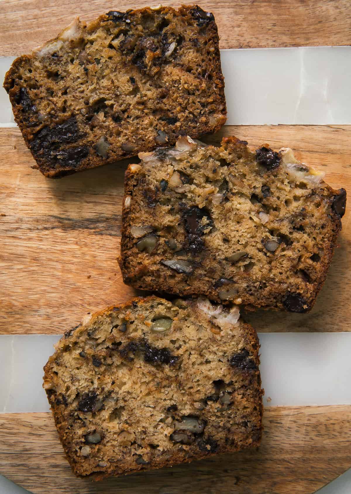 Slices of banana bread on cutting board. 