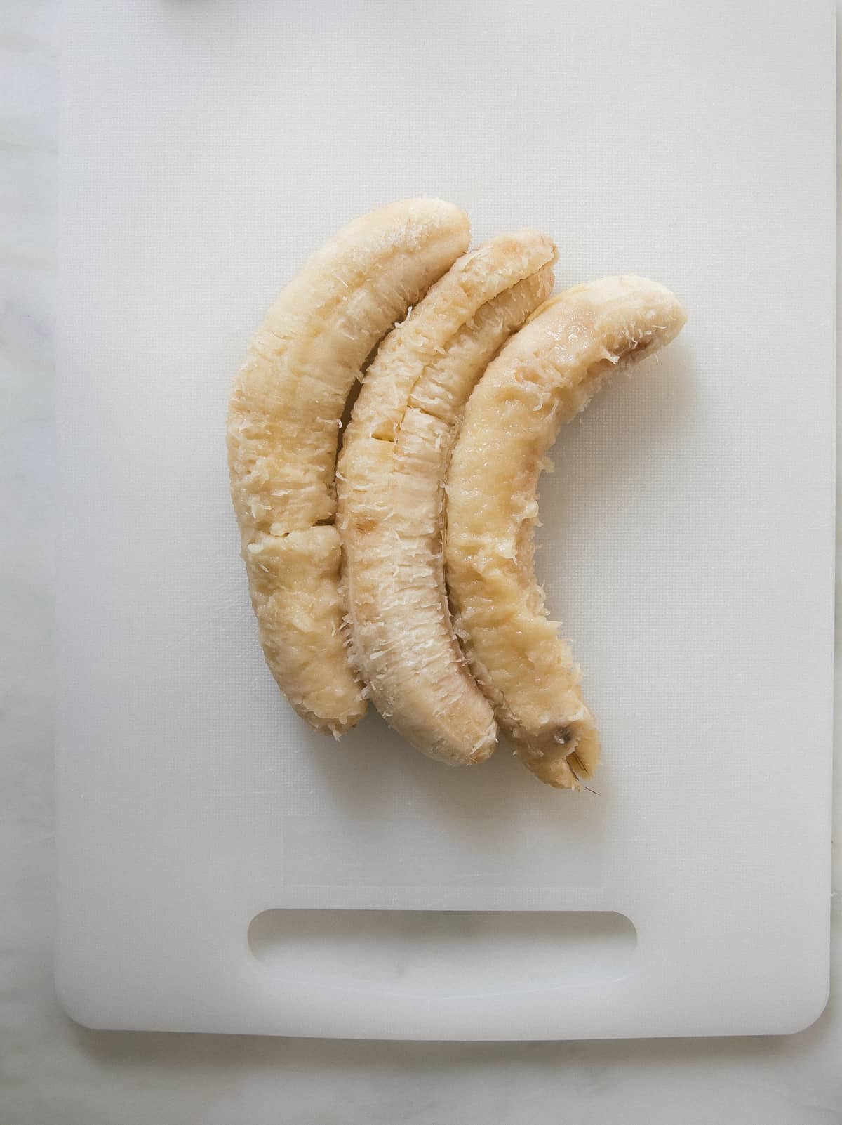 Bananas being mashed. 