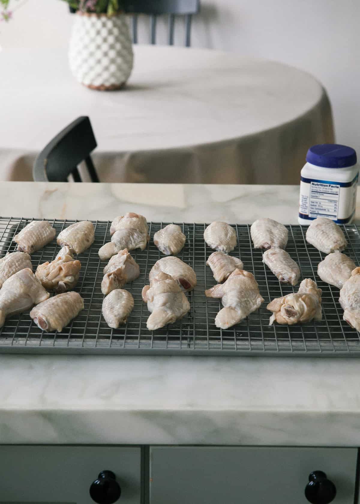 raw chicken wings on baking sheet 