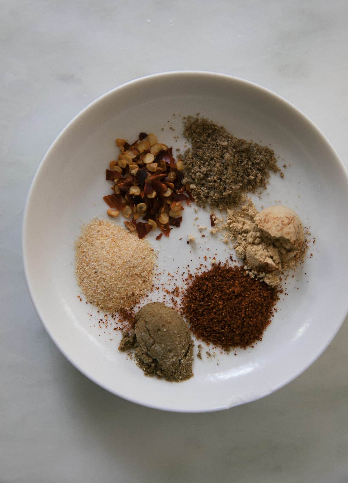 small plate with a variety of spices