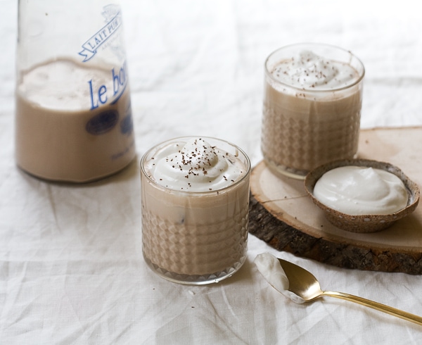 Homemade Irish Cream in glasses with whipped cream on top. 