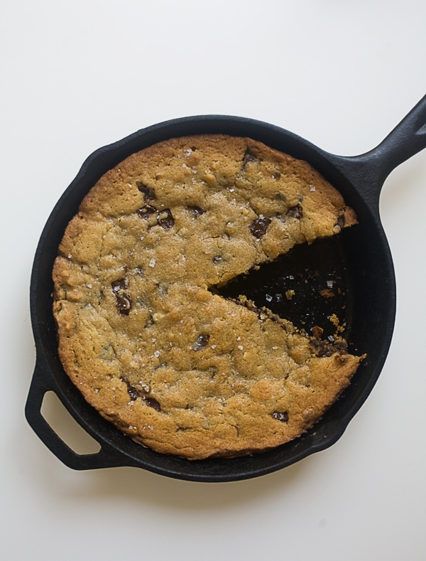 Chocolate Chip Skillet Cookie with a slice taken out. 