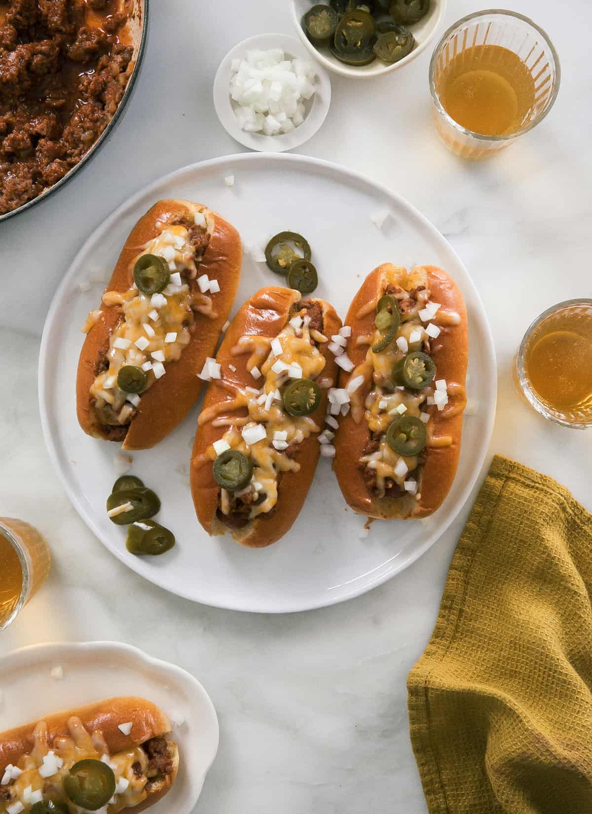 All melty chili cheese dogs with jalapeño and onion on top. 