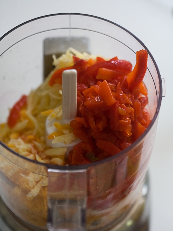 All of the ingredients added to a food processor. 