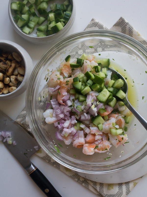 Shrimp Ceviche being tossed together. 