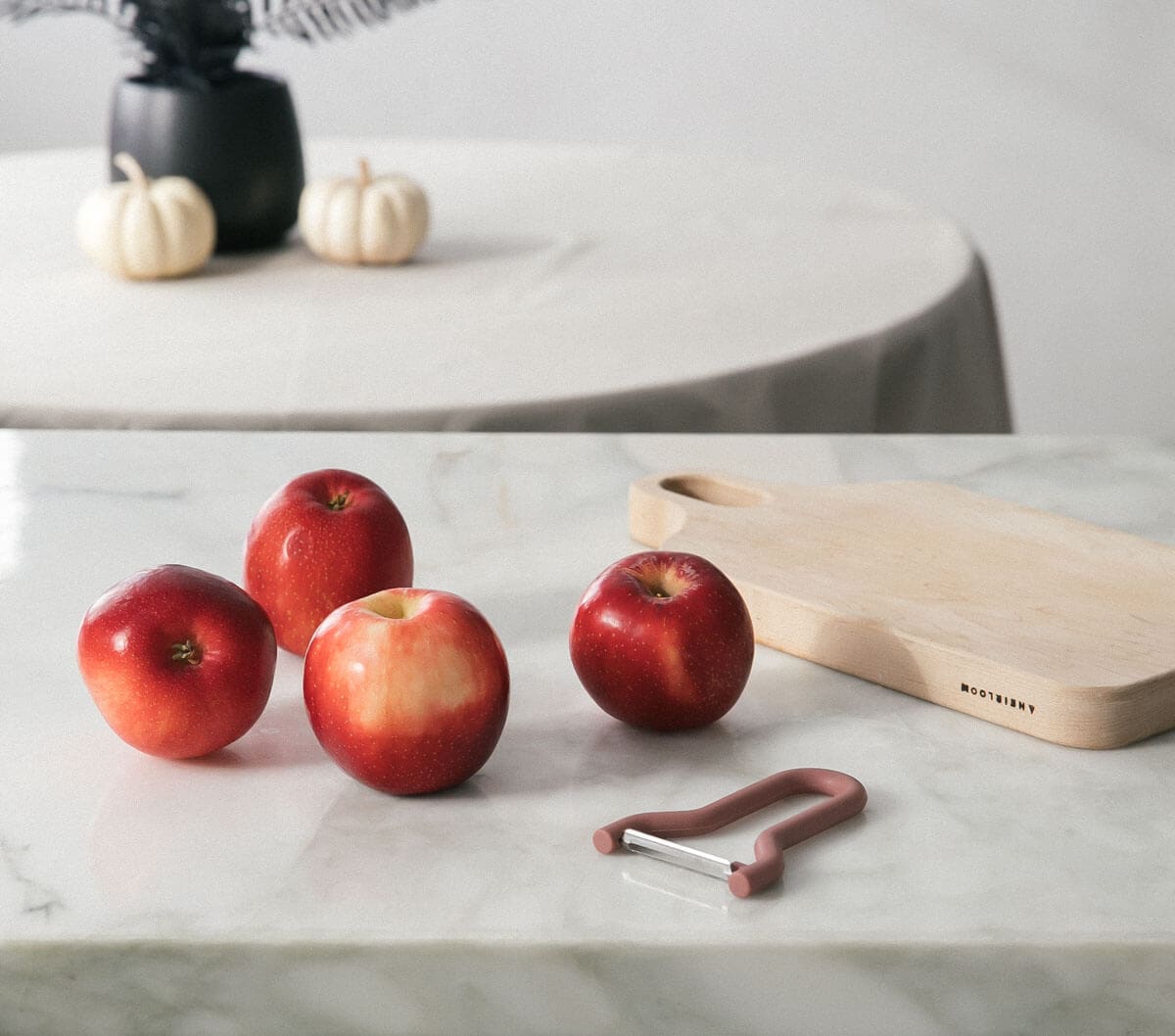 A variety of apples on the counter. 