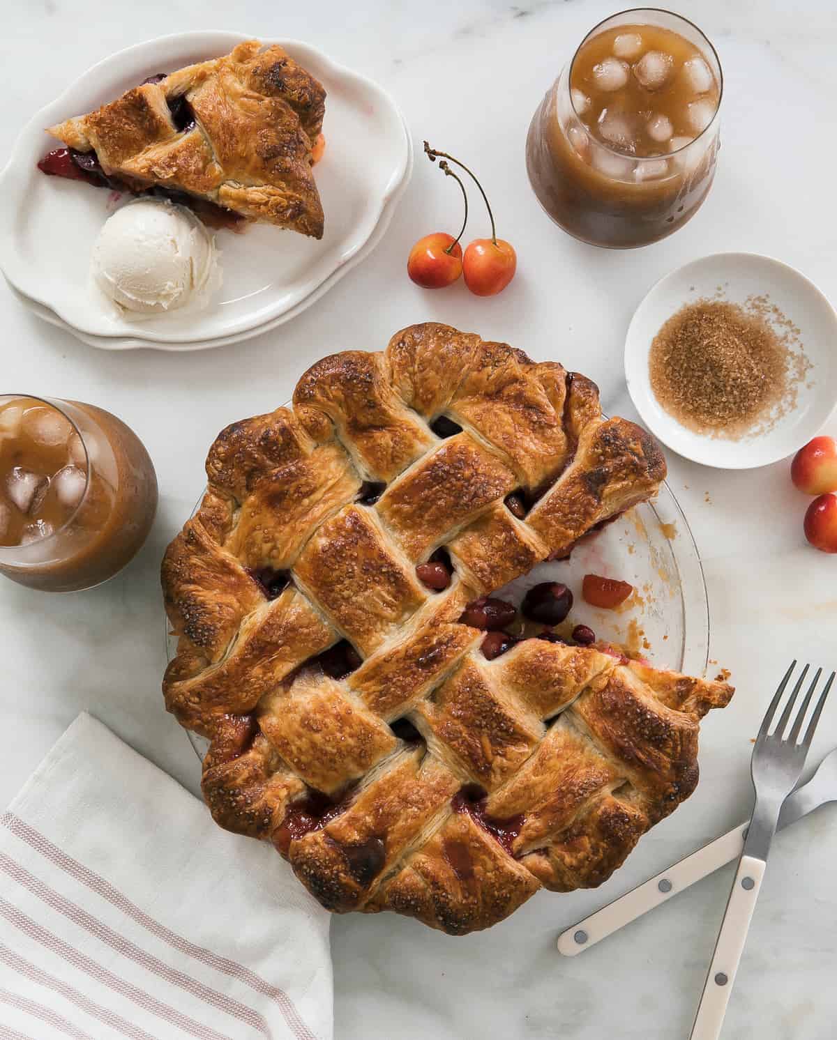 Classic Cherry Pie overhead shot with iced coffee near by.