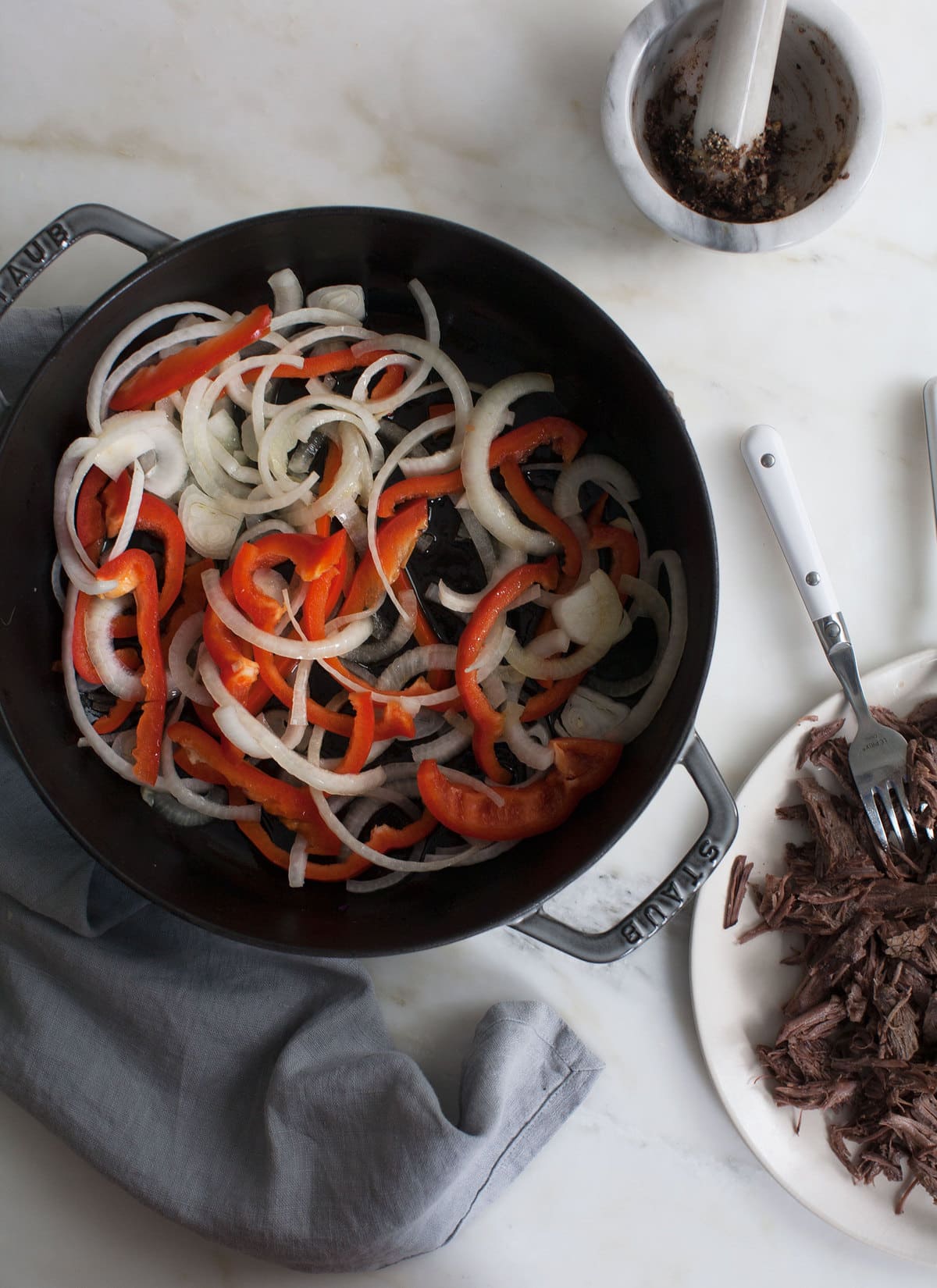 Beef shredded on the side with onions and bell pepper. 