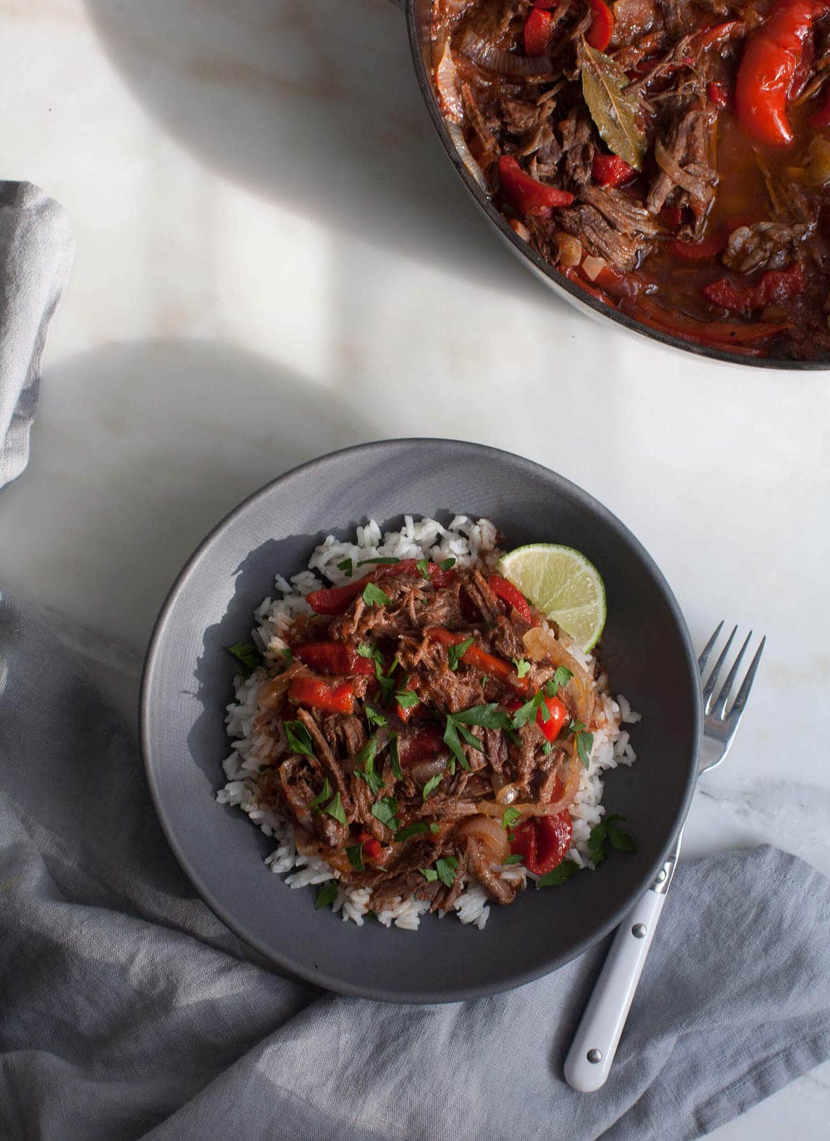 Rope Vieja in a bowl over rice. 