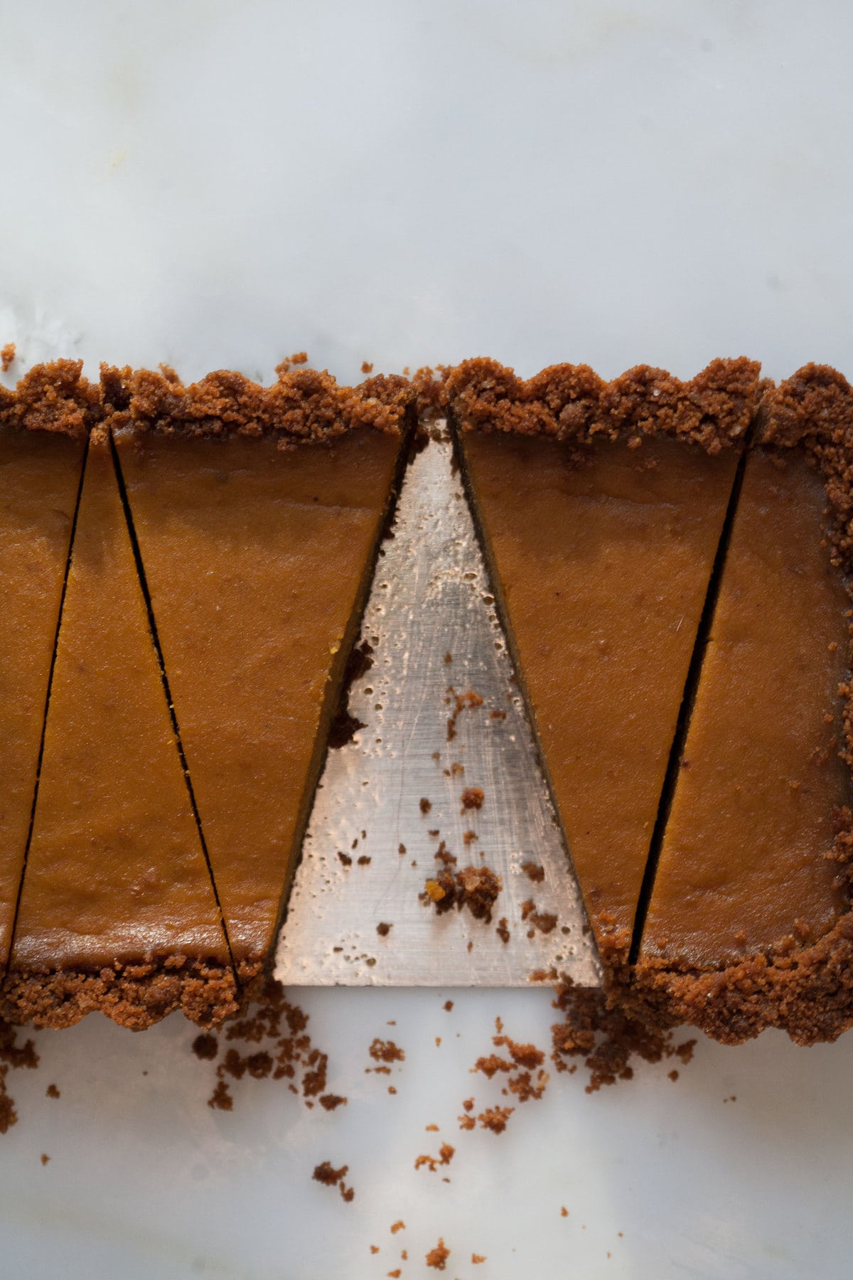 Butterscotch Pumpkin Pie Slices in Pan. 