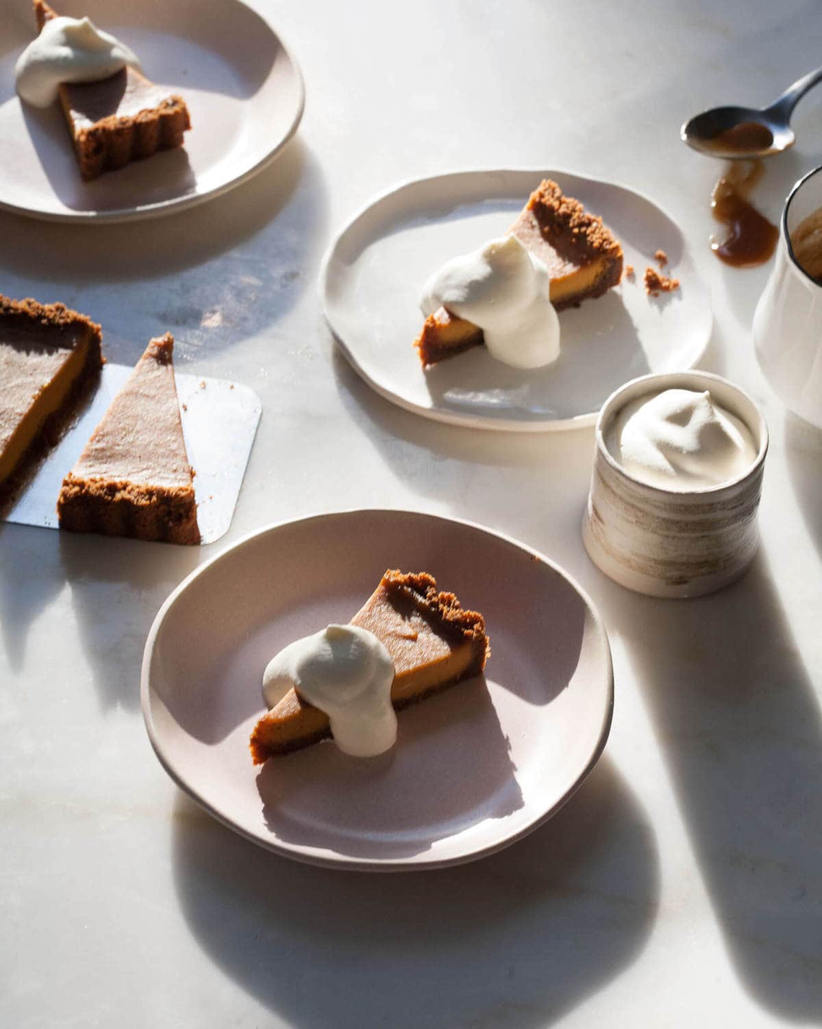 Butterscotch Pumpkin Pie slices on plates. 