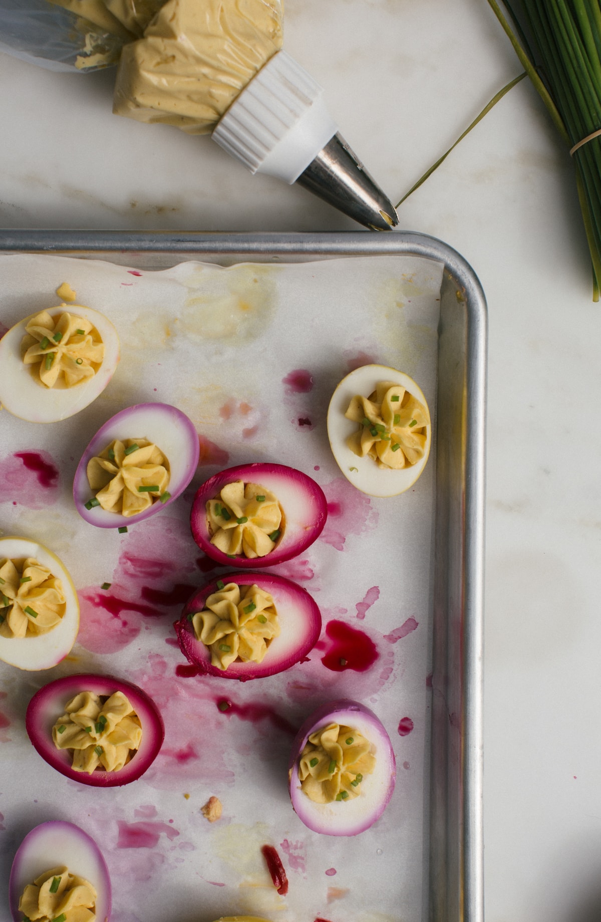 Deviled eggs on a sheet pan.