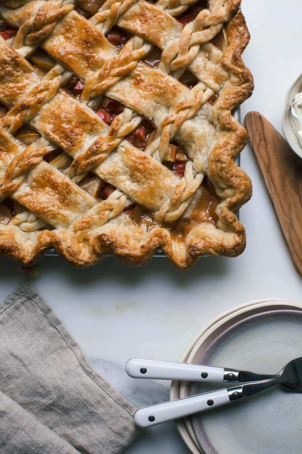 Close up image of rhubarb slab pie in a pie pan.