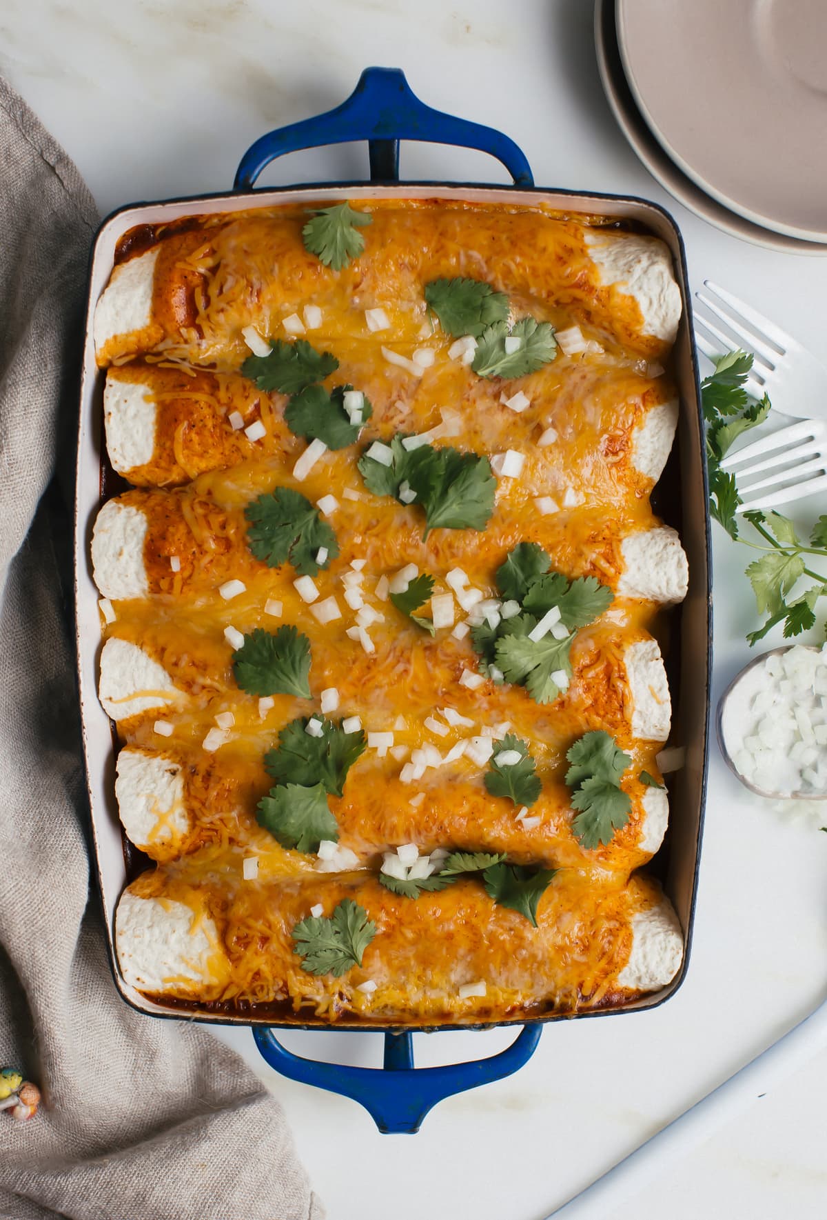 Baked dish of spinach enchiladas.