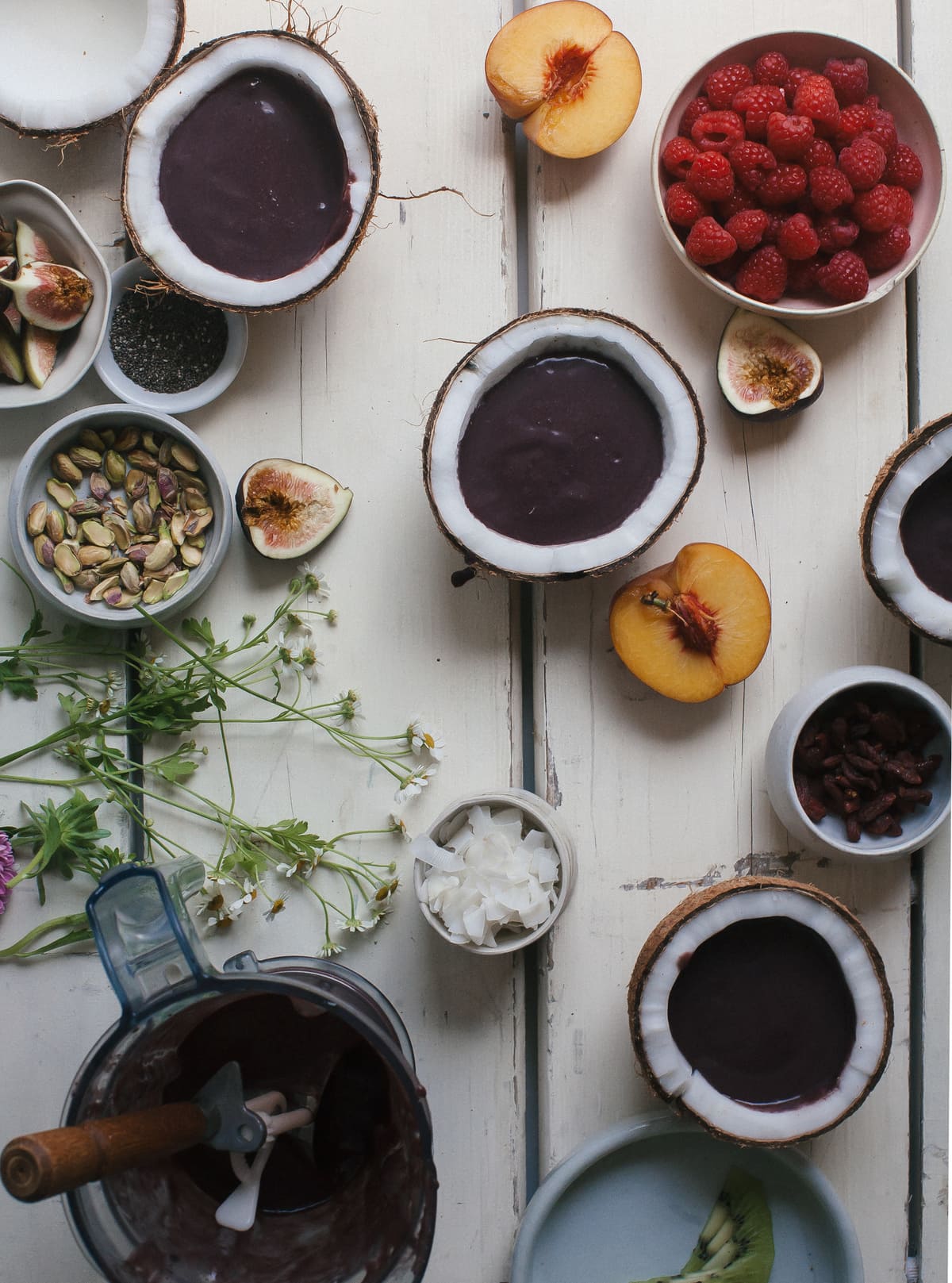 Acaí Bowls in coconuts with toppings. 