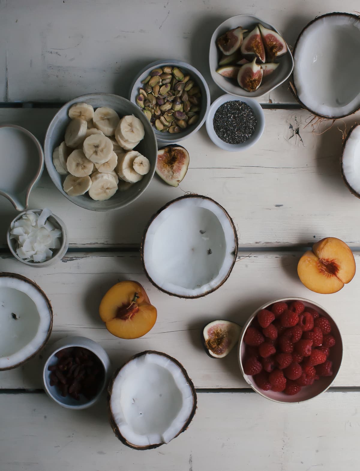 Acaí Bowls in coconuts with toppings. 