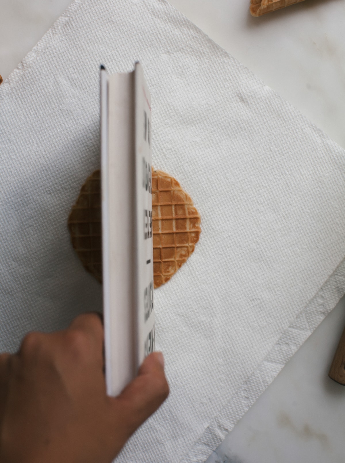 Waffle cone being shaped. 