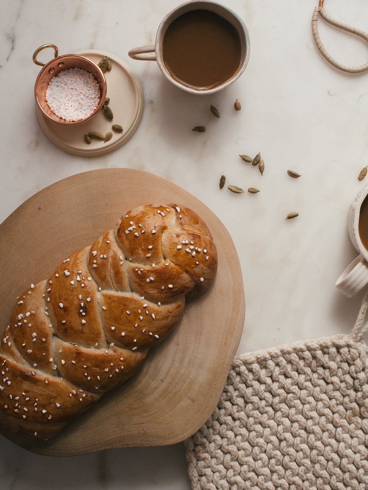 Swedish Cardamom Braided Bread on a trivet. 