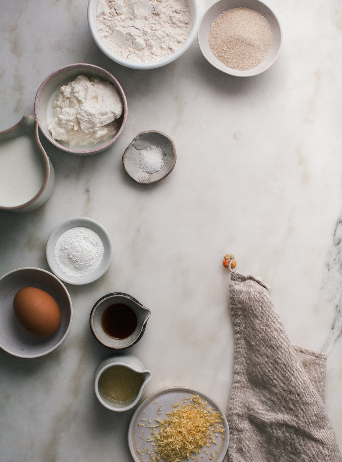 Lemon ricotta pancake ingredients on a counter.