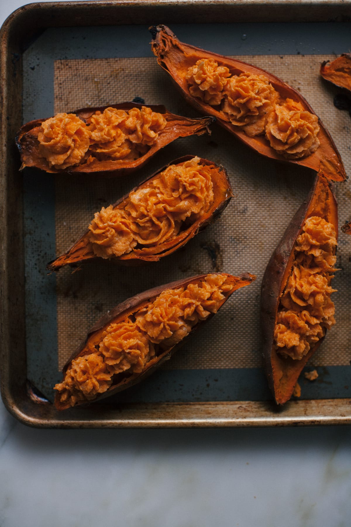 Double Baked Sweet Potato with Caramelized Onions + Comté + Rosemary Butter