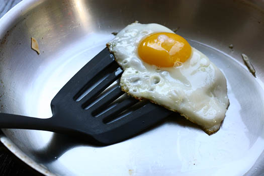 Fried egg in pan.