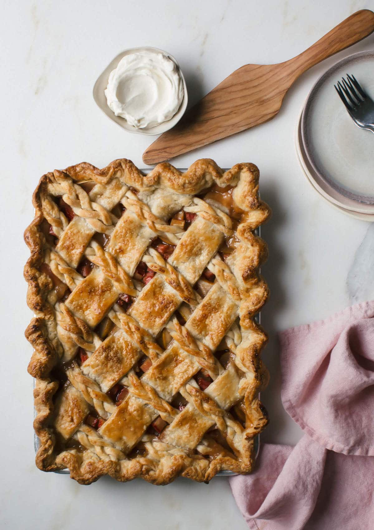 Overhead image of rhubarb slab pie in a pie pan. 