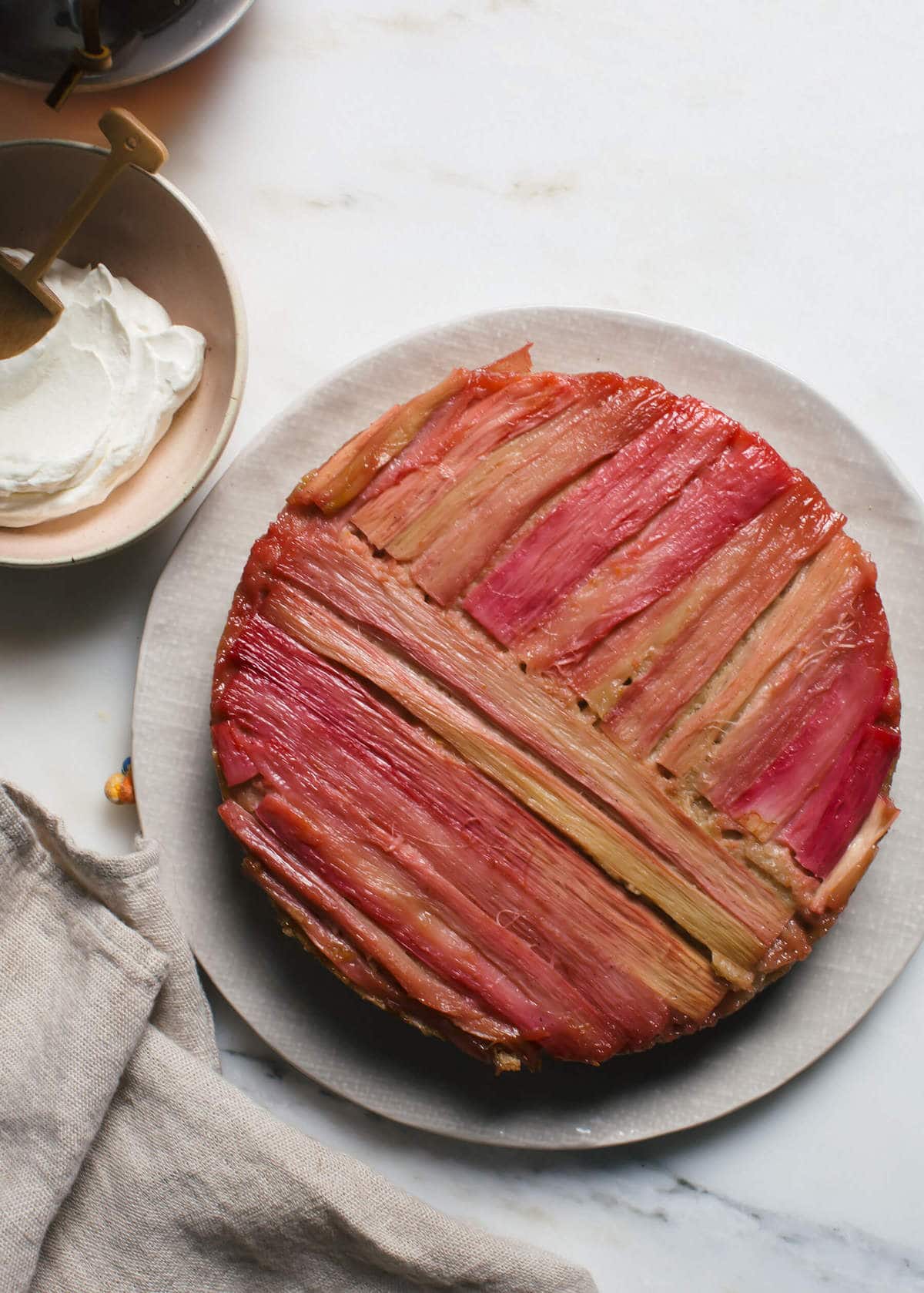 Close up image of a rhubarb upside down cake on a plate.
