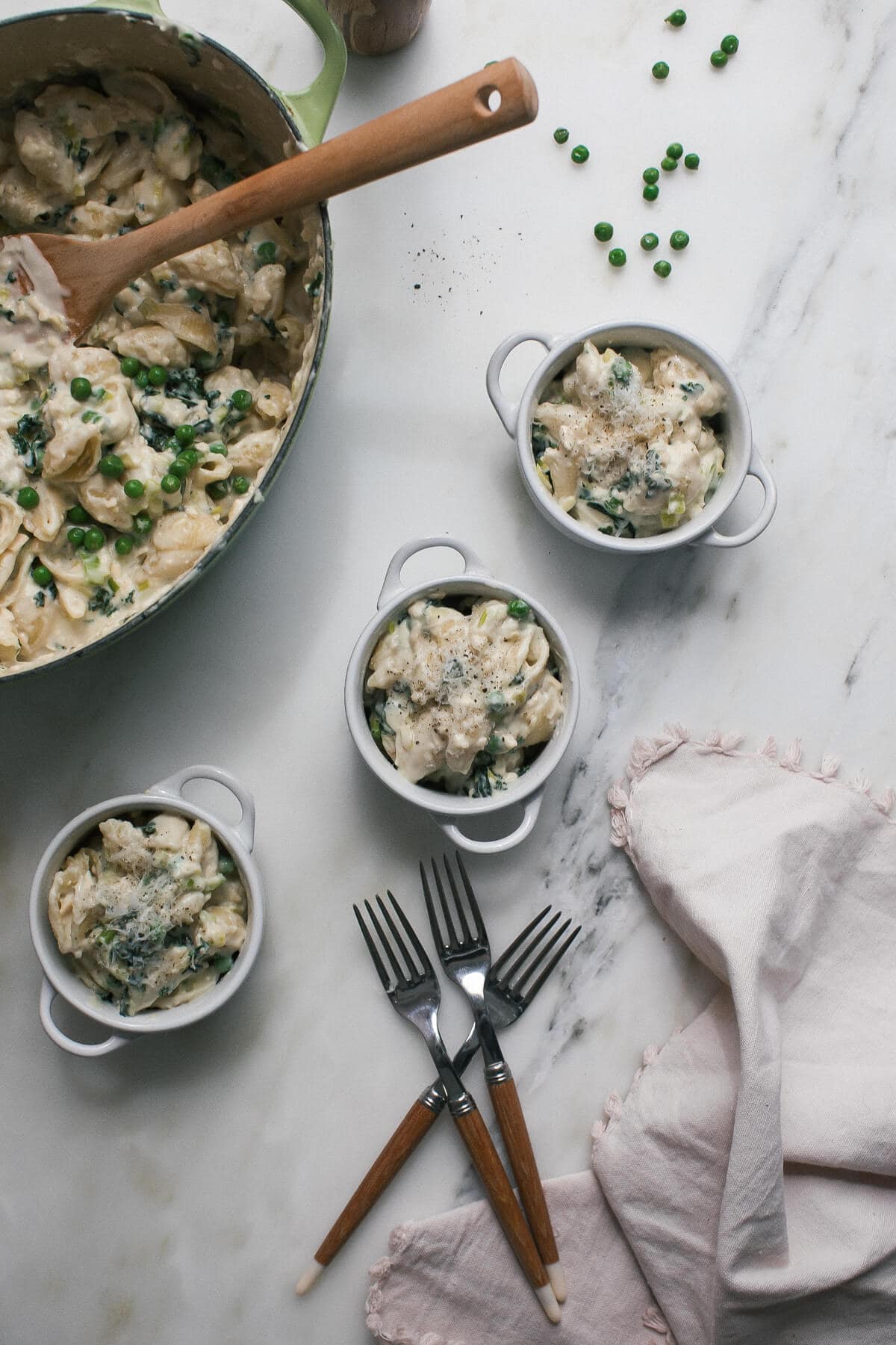 Overhead image of macaroni and cheese in three small bowls. 