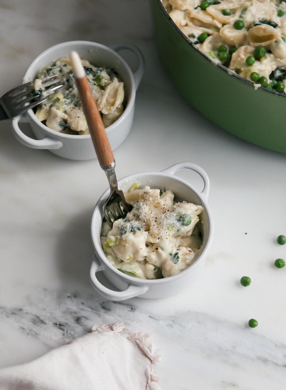 Stovetop macaroni and cheese in a small bowl with a fork.