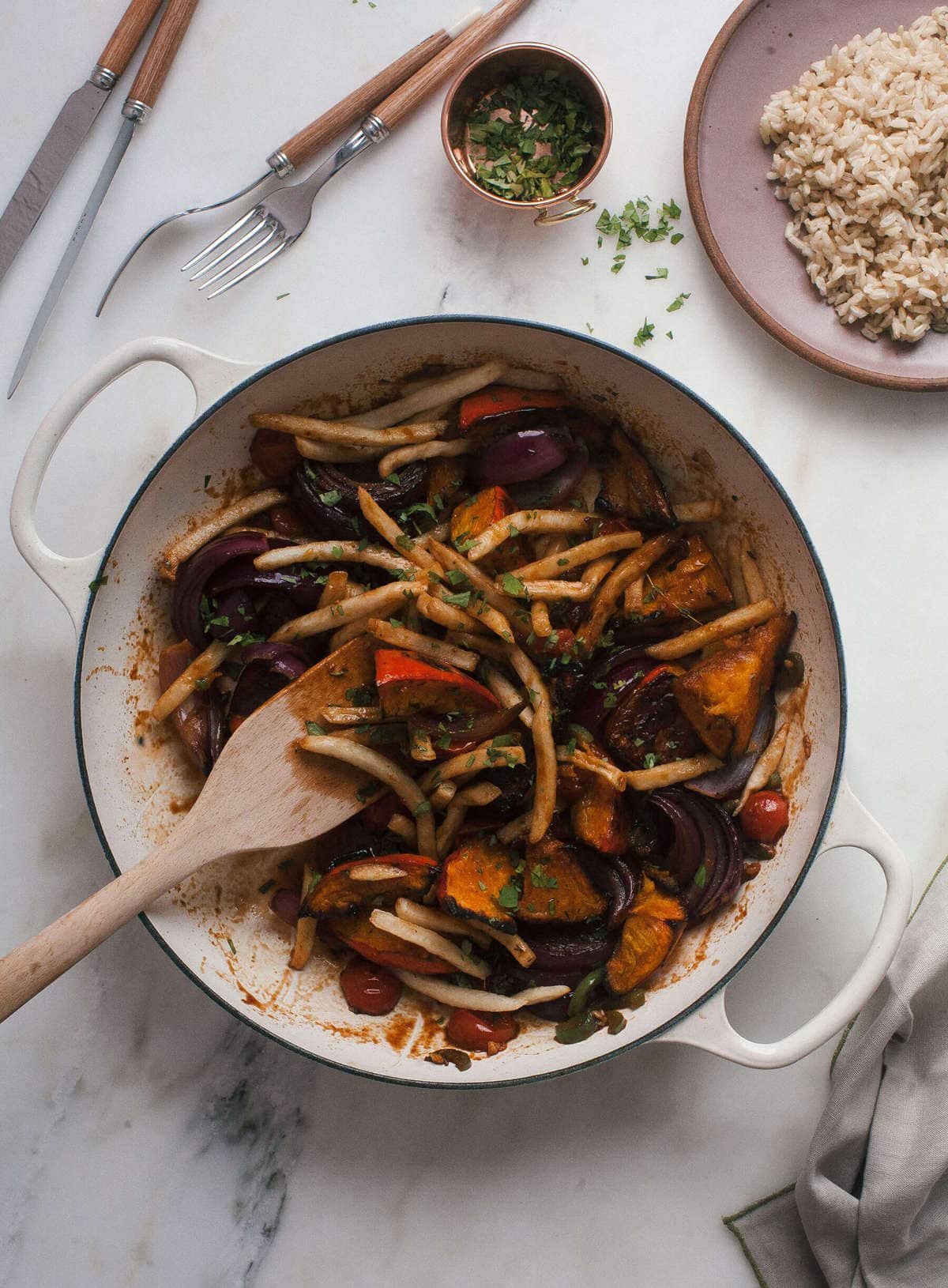 Overhead image of squash and fries in a skillet. 