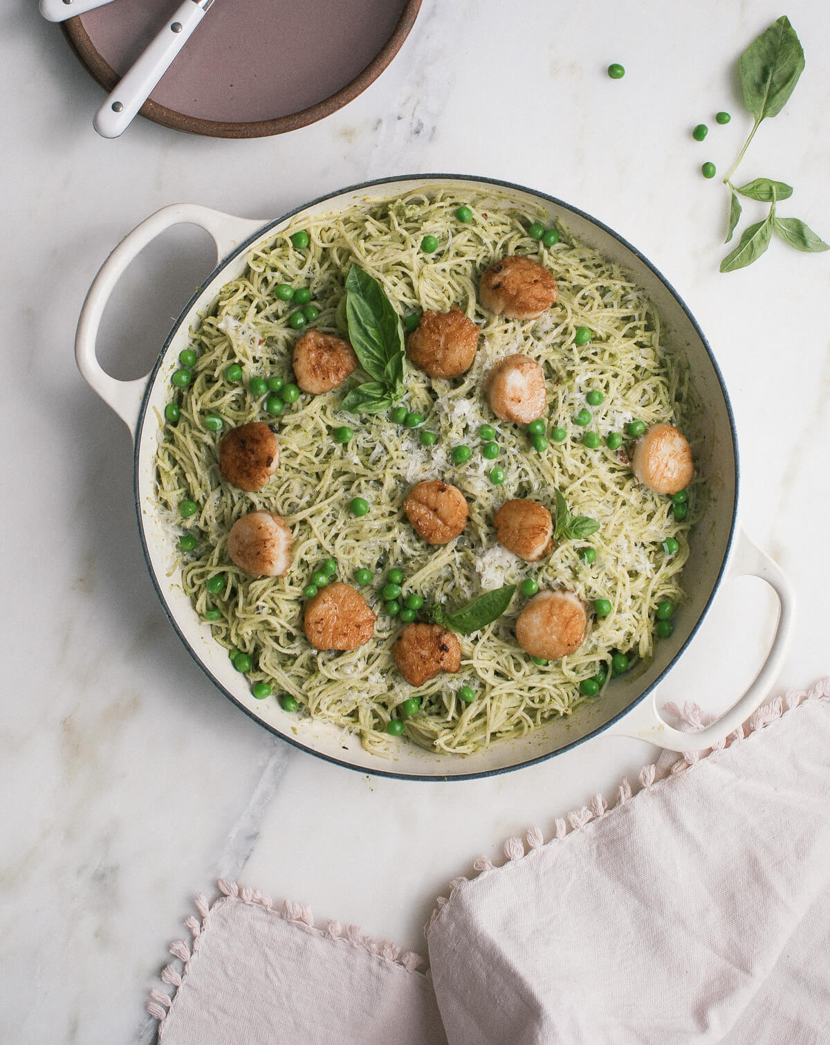 Overhead image of seafood pasta in a dutch oven. 