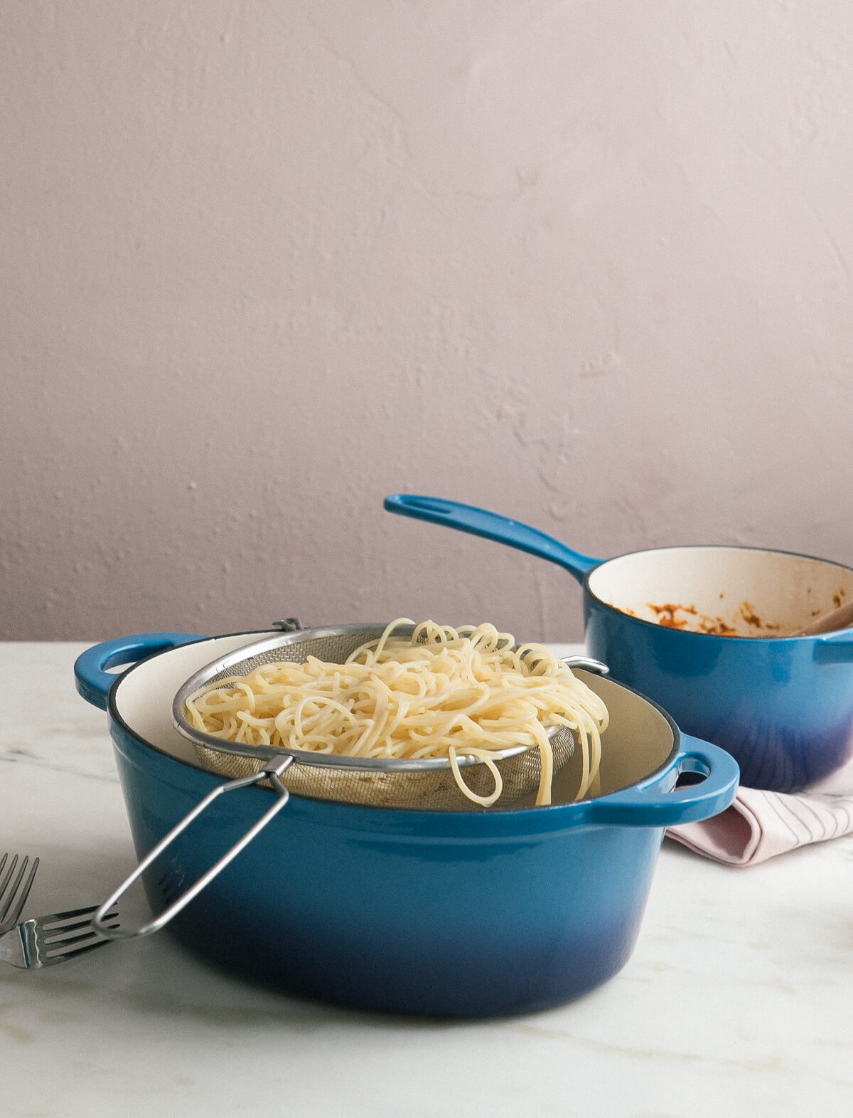 Pasta being strained. 