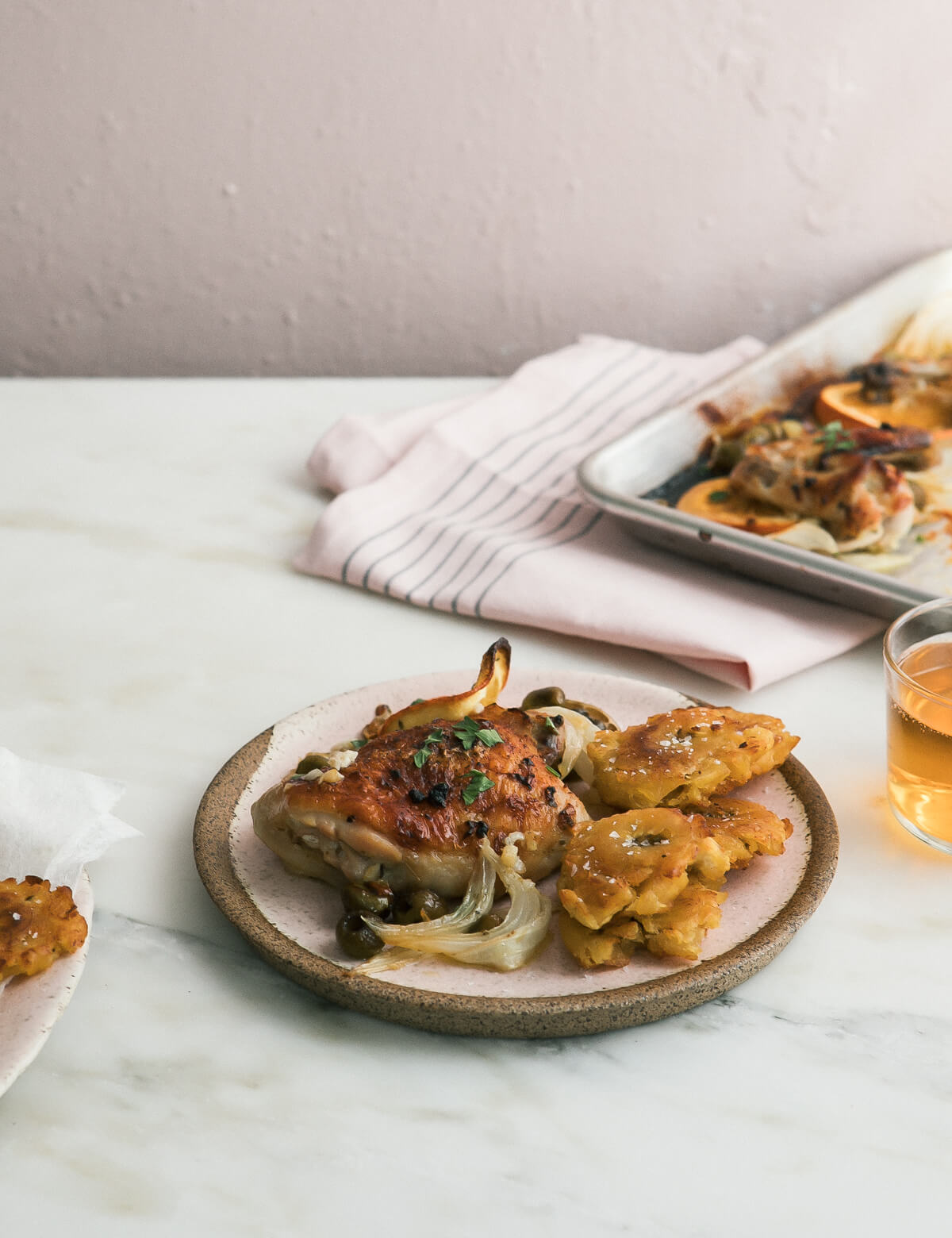 Mojo sheet pan chicken on a plate.