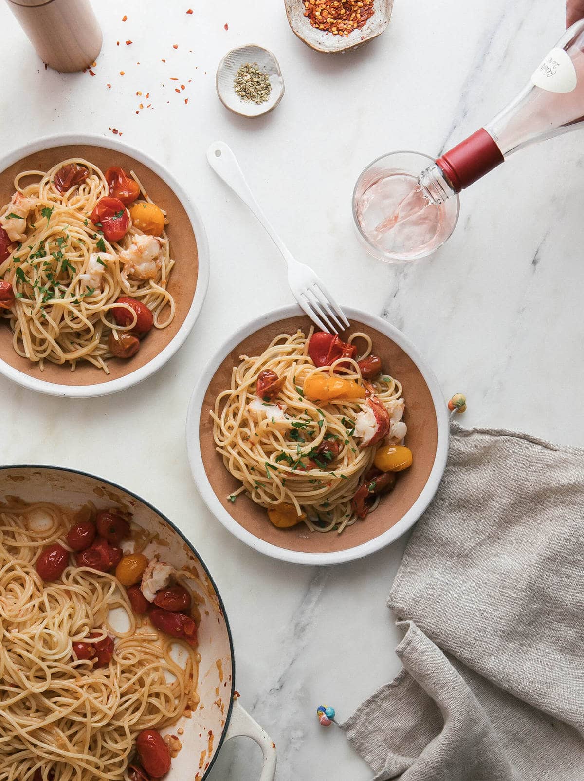 Lobster Pasta with Cherry Tomatoes on two plates. 