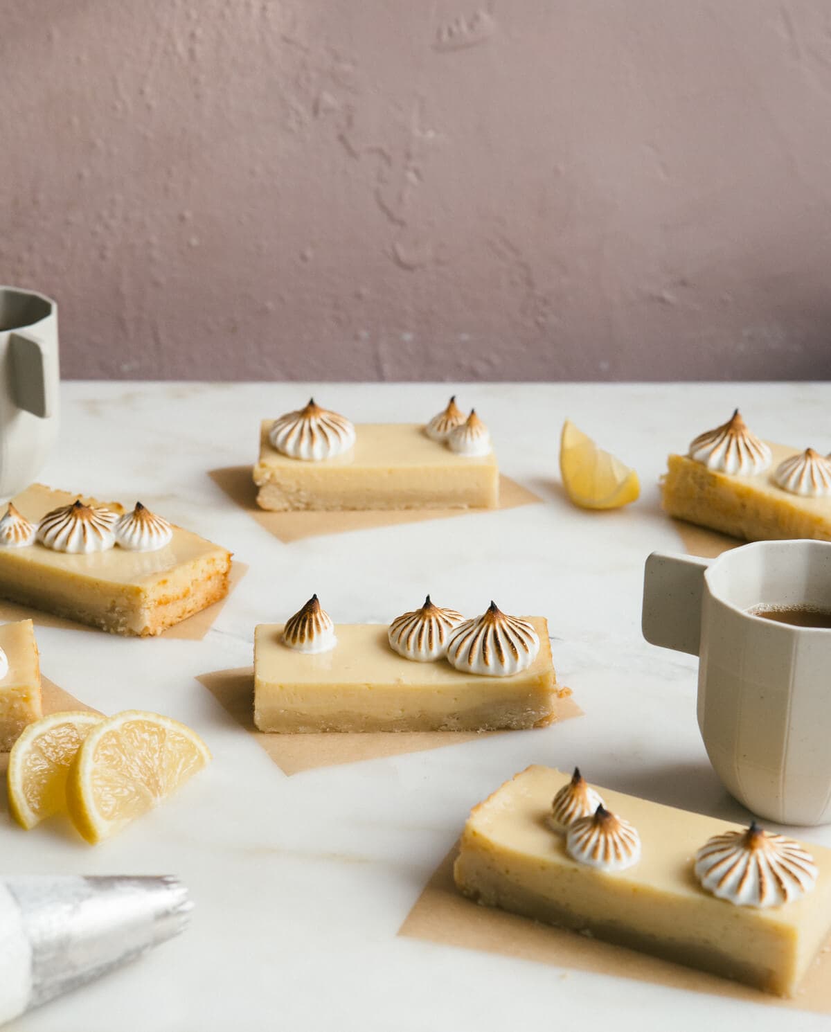 Side view of citrus bars topped with browned meringue topping.