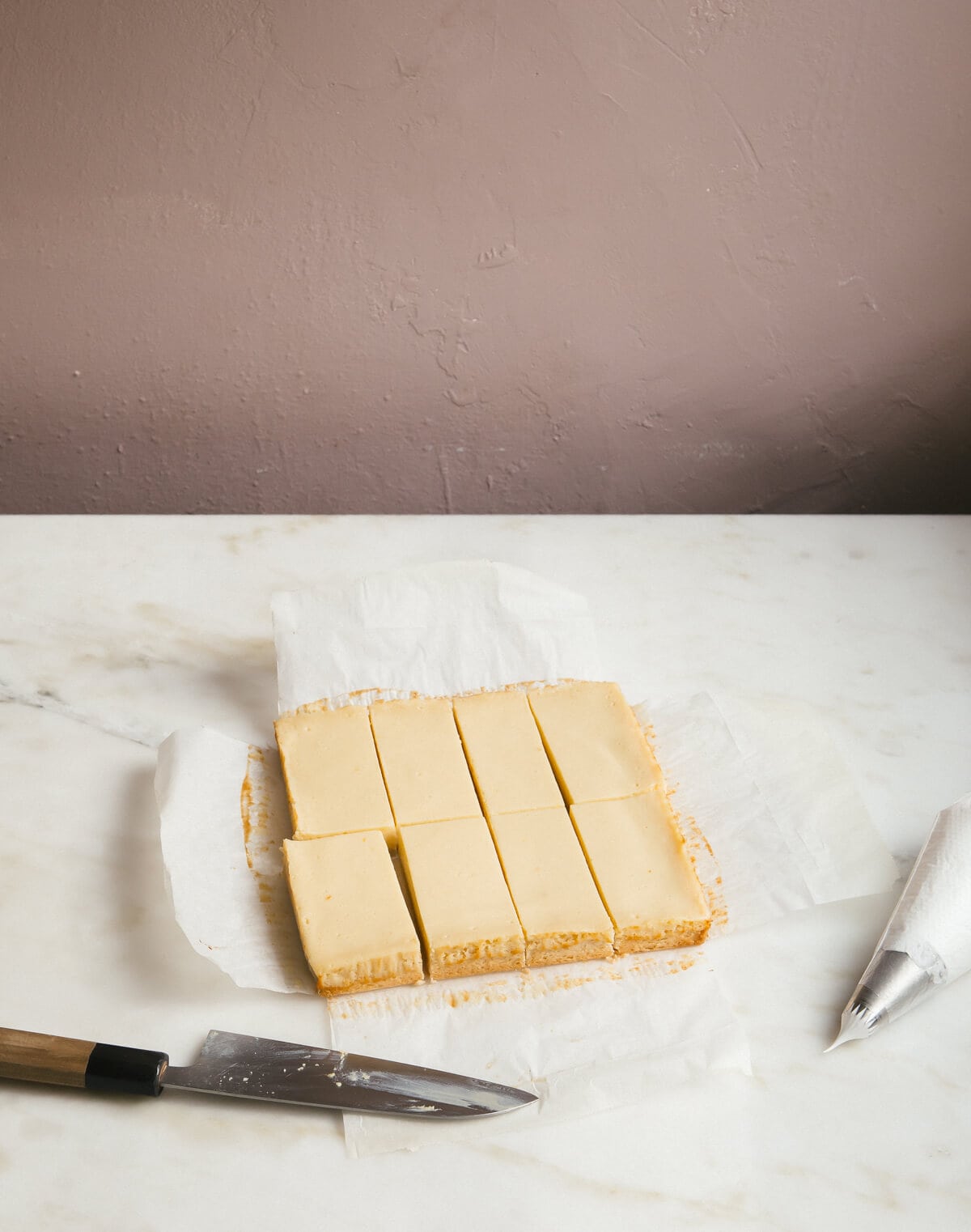 Baked lemon lime bars on parchment.