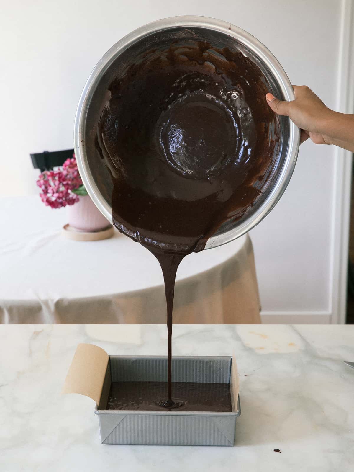 chocolate batter going into pan