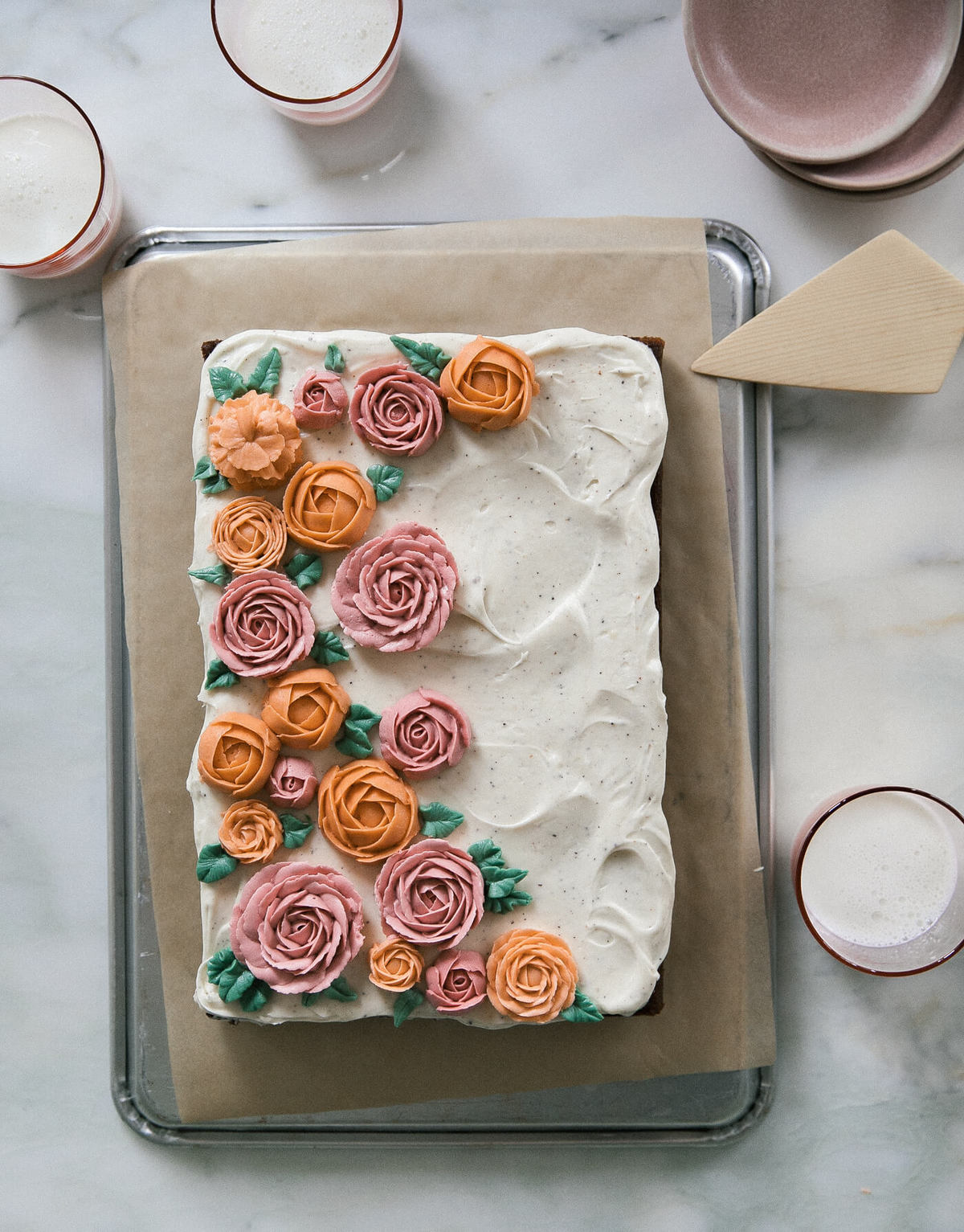 Carrot Sheet Cake with Buttercream Flowers on pan. 