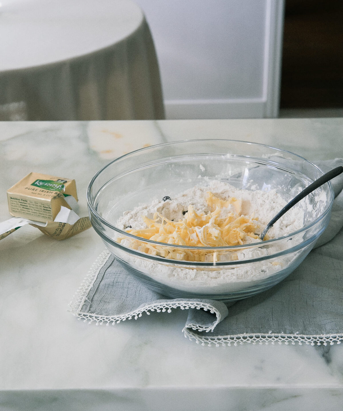 Grated butter in a bowl with flour.