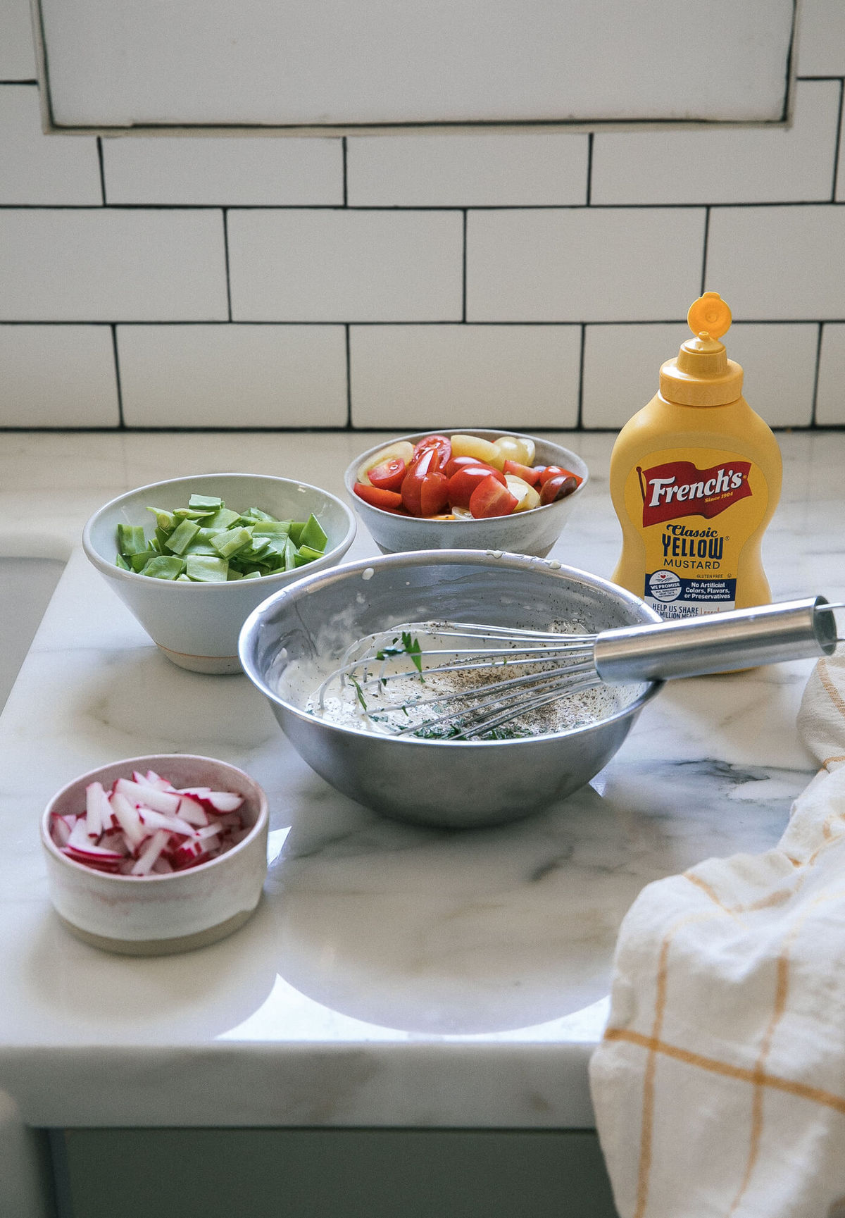 All of the ingredients for the pasta salad on counter. 