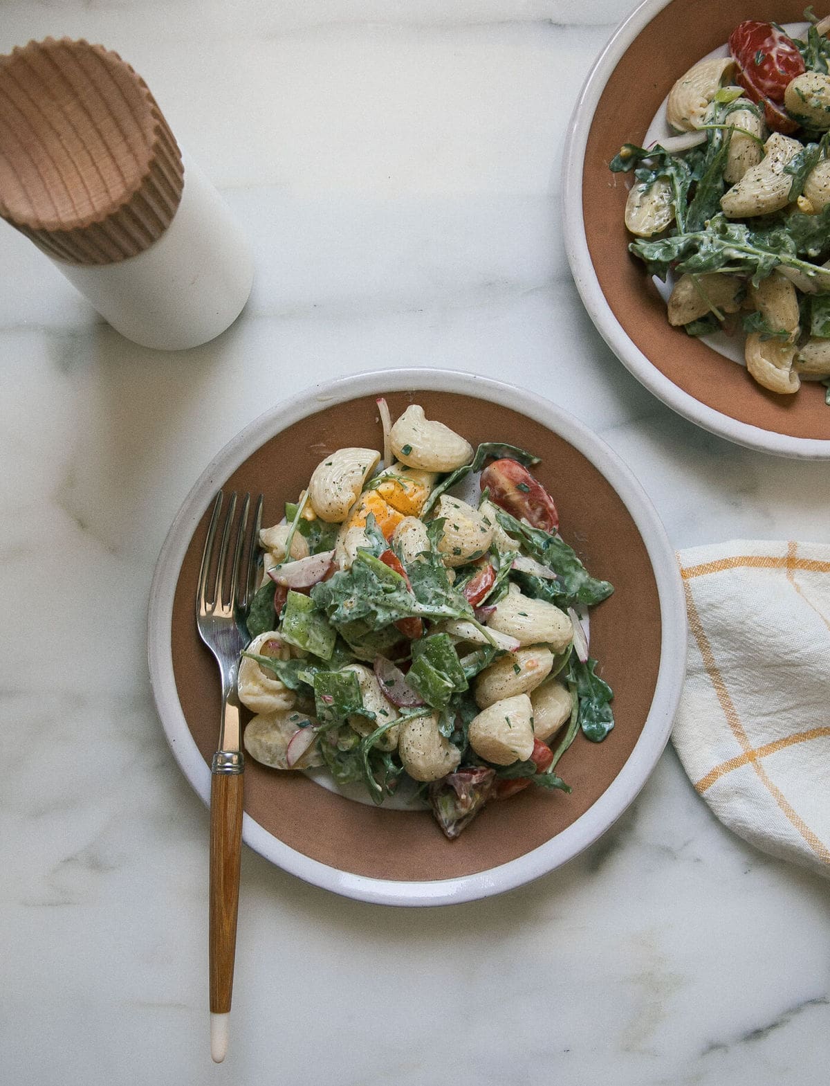 Seven Layer Pasta Salad serving on plate. 