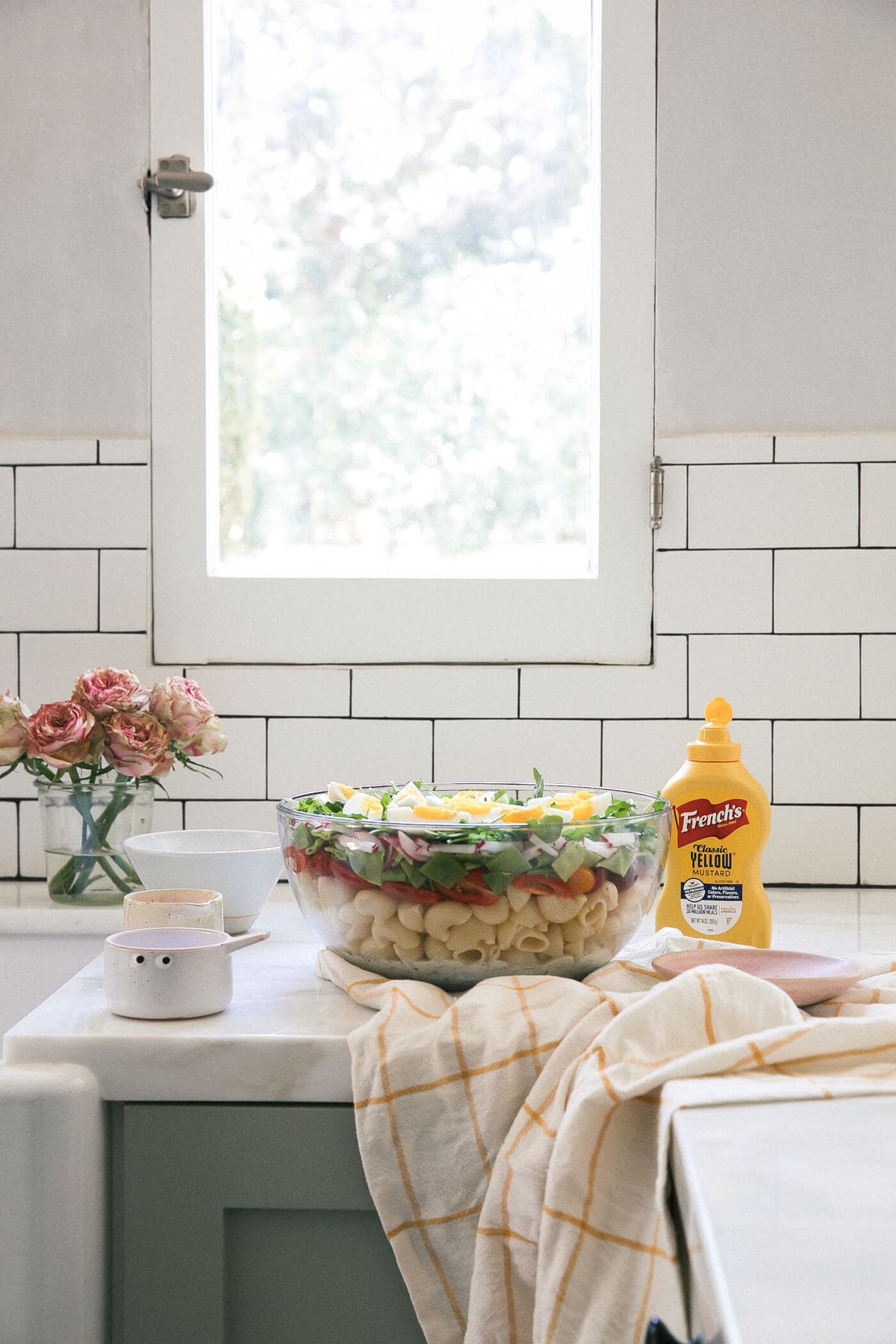 Seven Layer Pasta Salad in serving bowl on counter. 